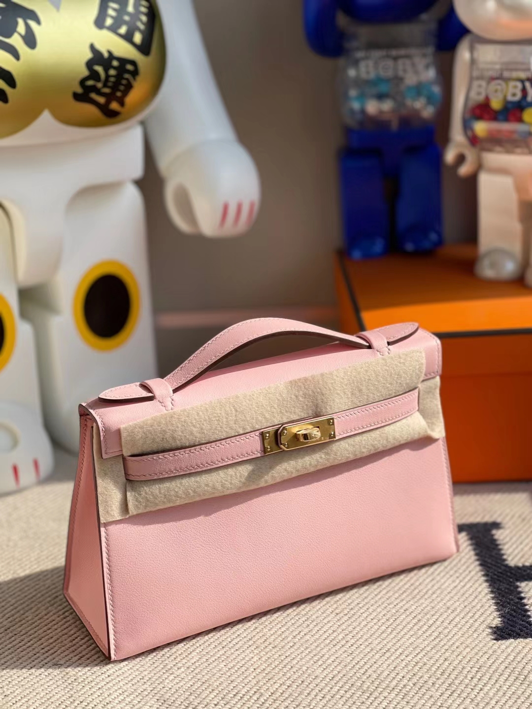 Hermès（爱马仕）MiniKelly Pochette Swift 进口平纹皮 3Q 水粉色 金扣 22cm
